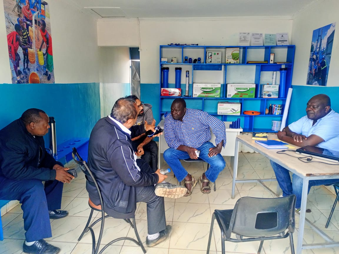 Team member drilling a borehole